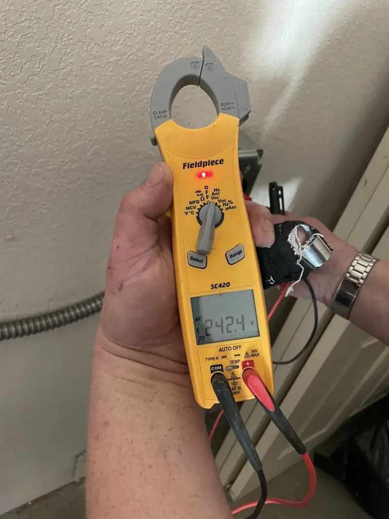 Voltage testing with clamp meter during Circuit Breaker Repair in Longmeadow